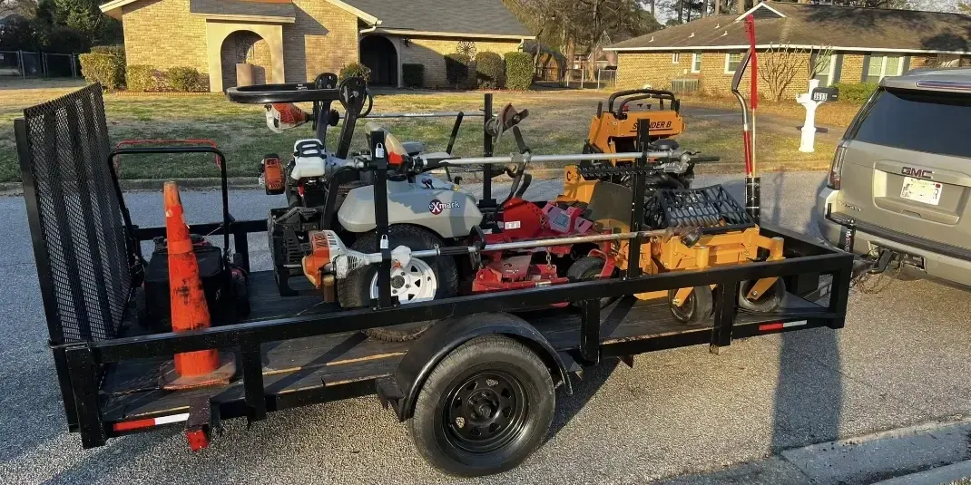 Truck and trailer with ride-on A lawn care trailer
