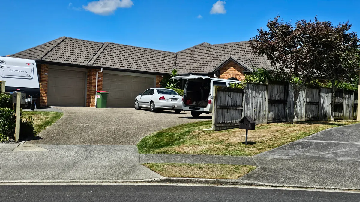 Lawn care van parked with the back open in a customer's driveway on a mowing day, where every lawn care app has to work from a phone