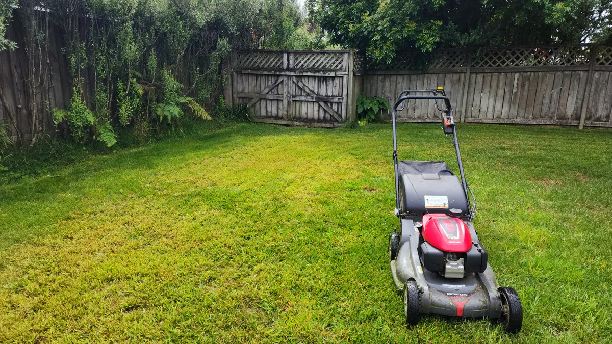 Honda mower on a freshly cut back lawn