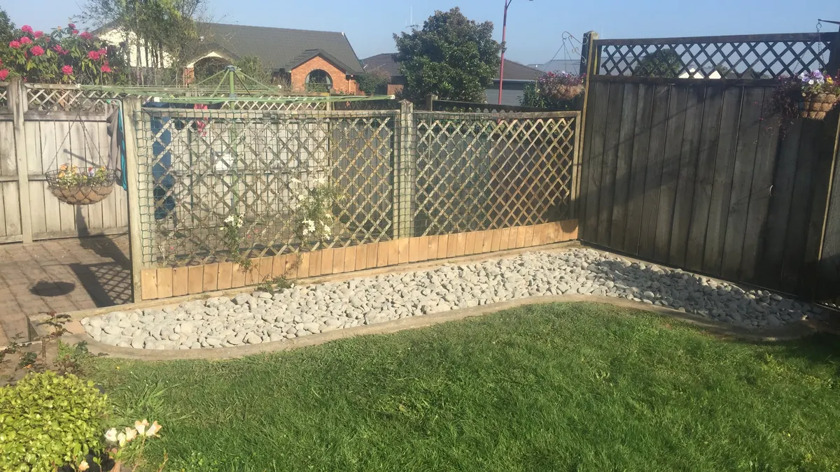 Freshly mown lawn behind a lattice fence