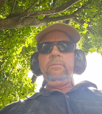 Stuart on the job with earmuffs on