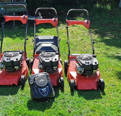 success in growing a business Three mowers lined up ready for work