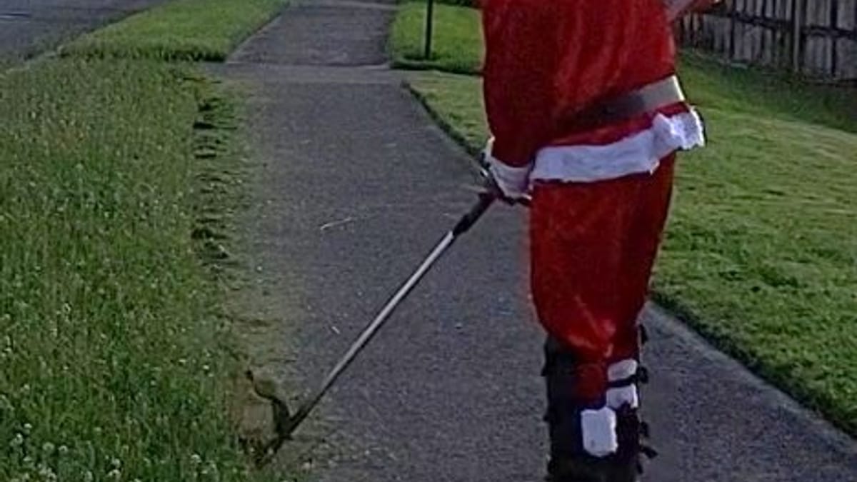 Santa trimming the edges on a Christmas job