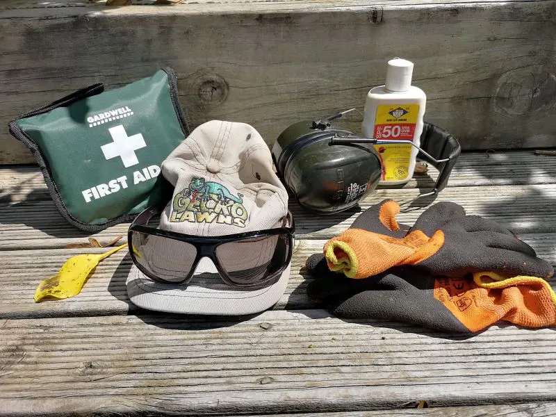 First aid kit, cap, safety glasses, earmuffs, gloves and sunscreen