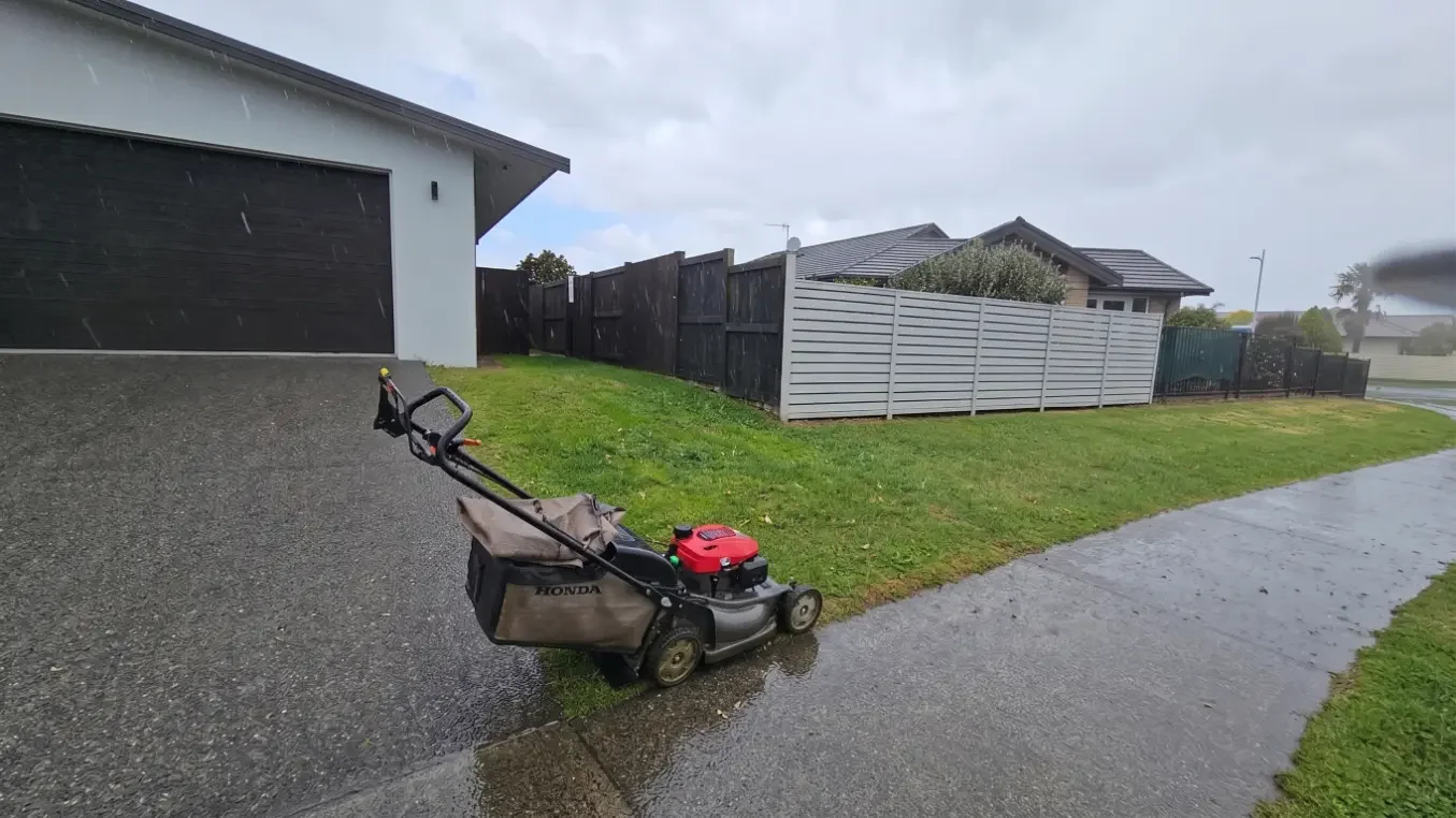 A lawnmower on a rainy day