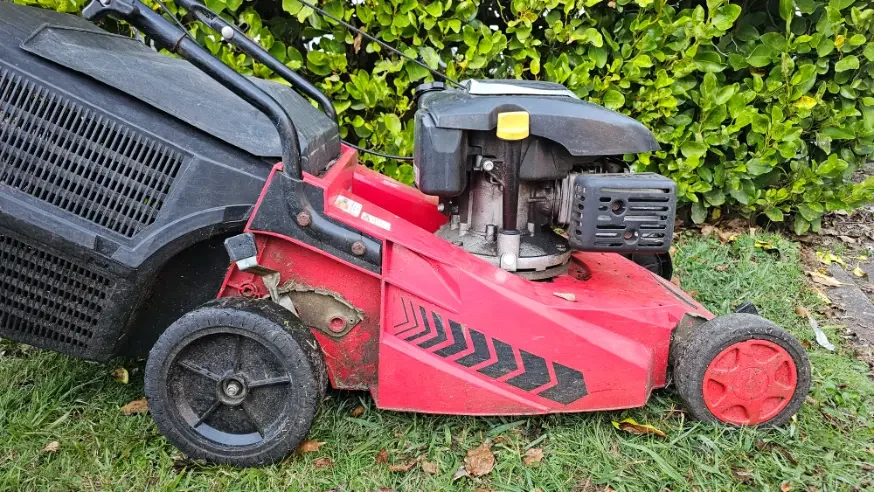 Height adjustment on a lawn mower