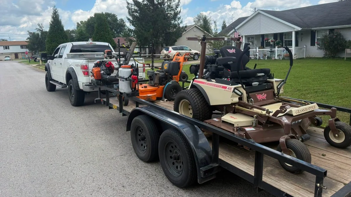 Ute and trailer loaded with mowers, the daily reality behind most lawn care business problems