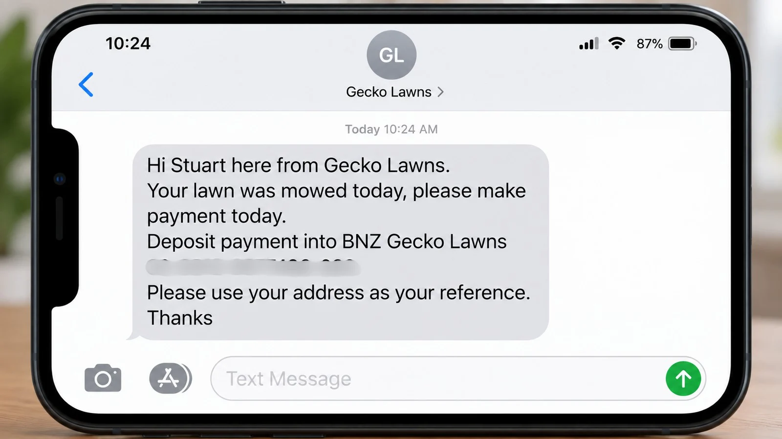 Phone showing the same-day payment text from Gecko Lawns, one of the lawn care text message templates in this post